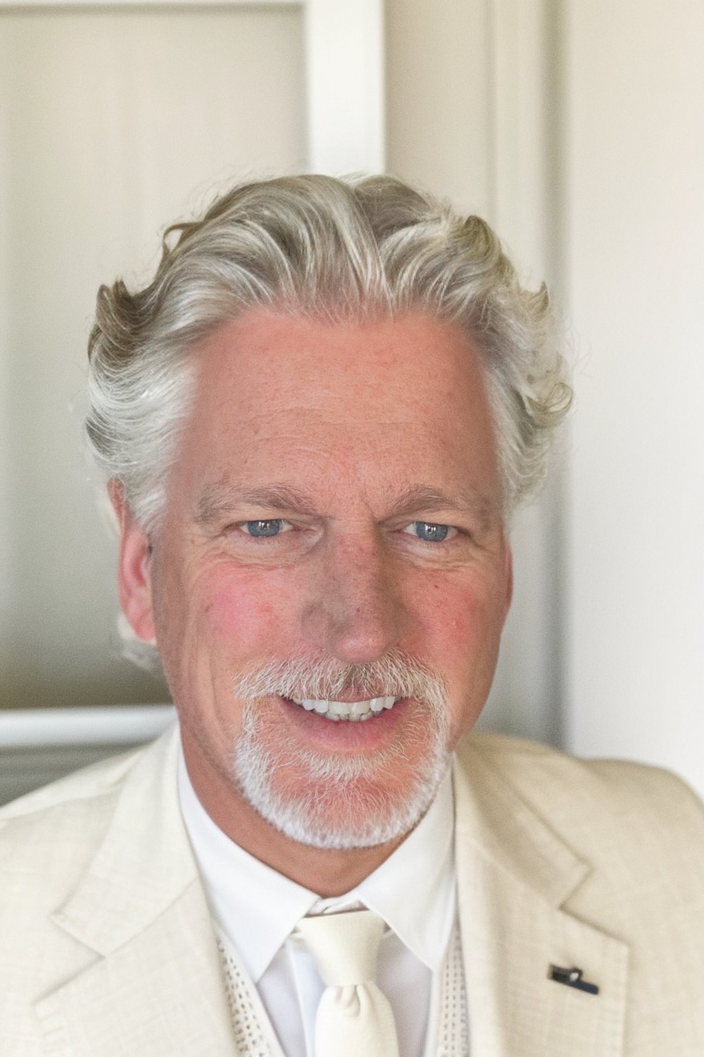 AI-generated headshot in white suit