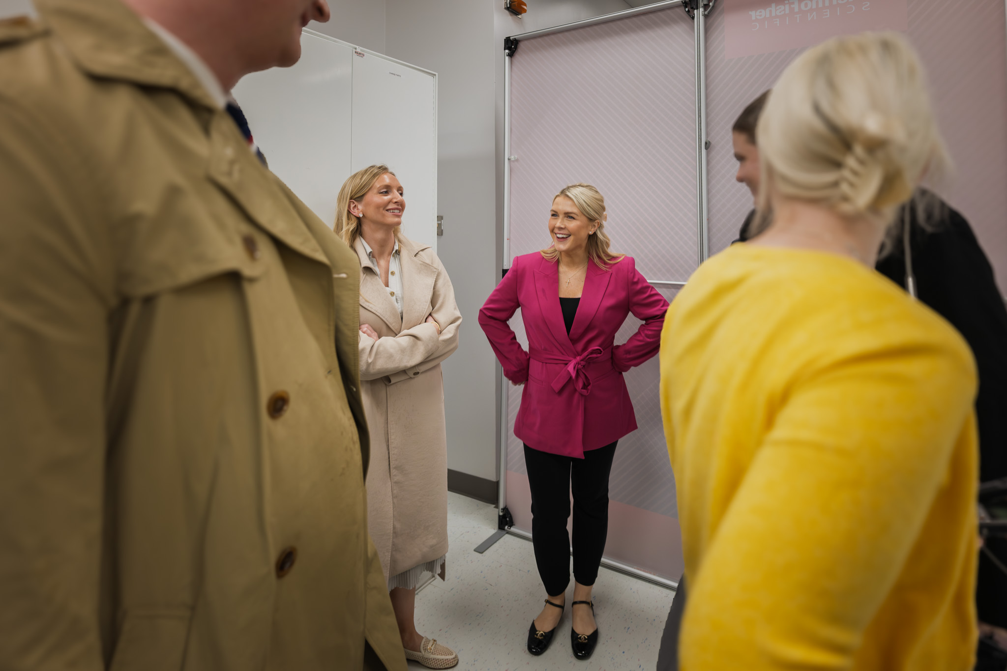 A candid moment between team members during the visit