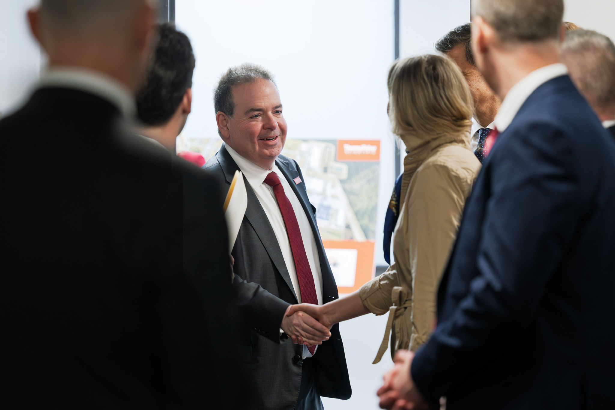 Company leadership welcomes guests during the visit