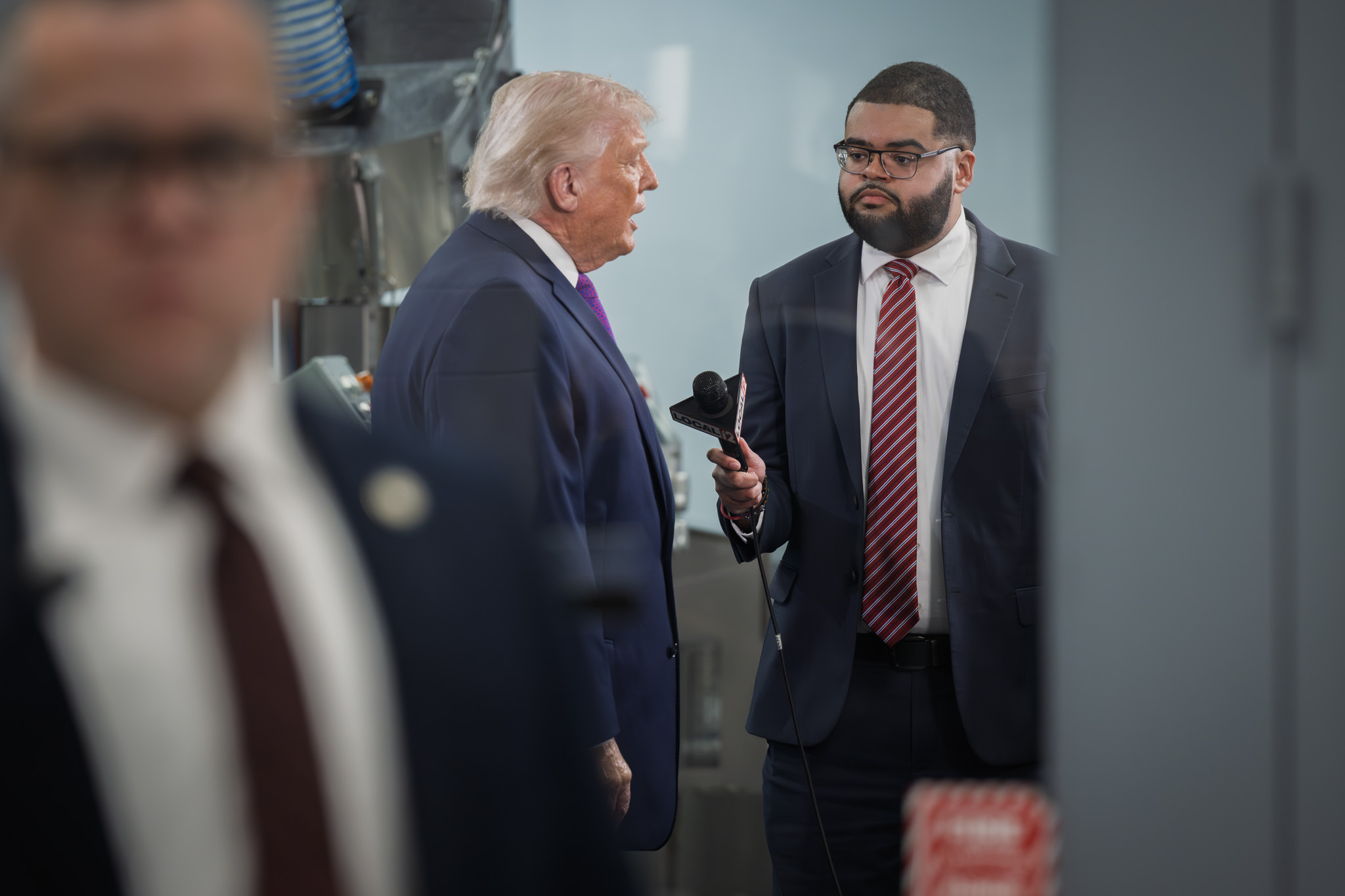 The President speaks with a member of the press